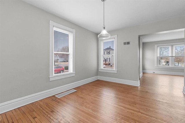 unfurnished dining area with light hardwood / wood-style flooring and a wealth of natural light