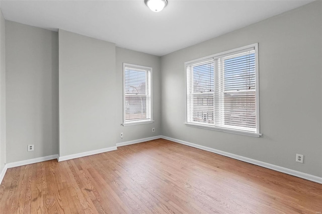 spare room with light wood-type flooring