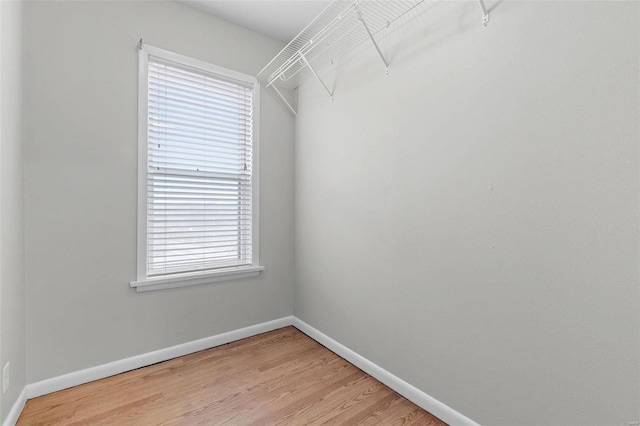 walk in closet featuring hardwood / wood-style flooring