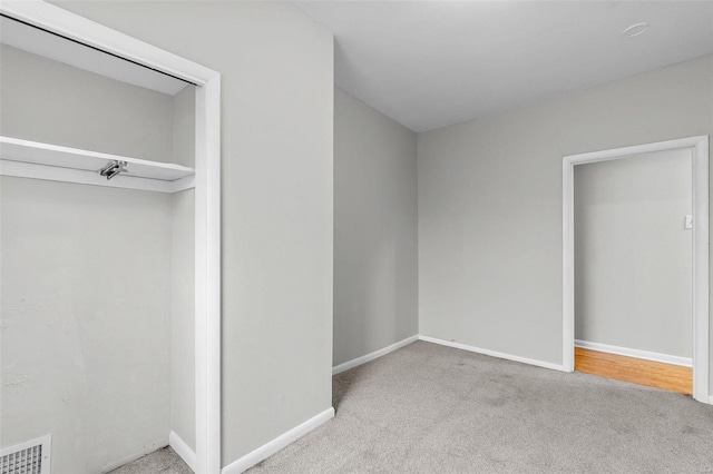 unfurnished bedroom featuring light colored carpet