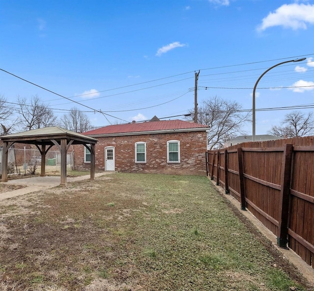 exterior space with a yard and a gazebo