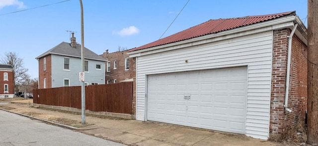 view of side of home with an outbuilding and a garage