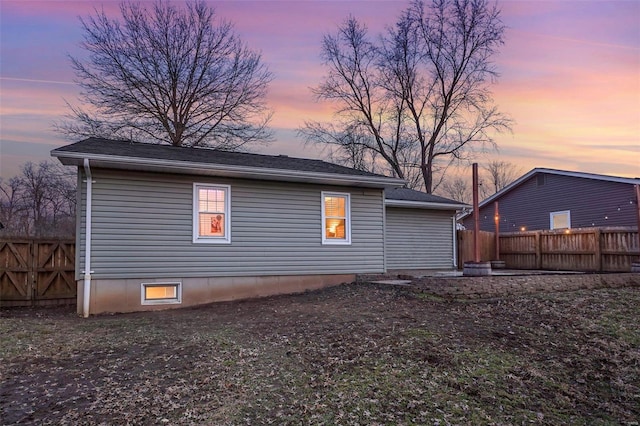 back of property with fence