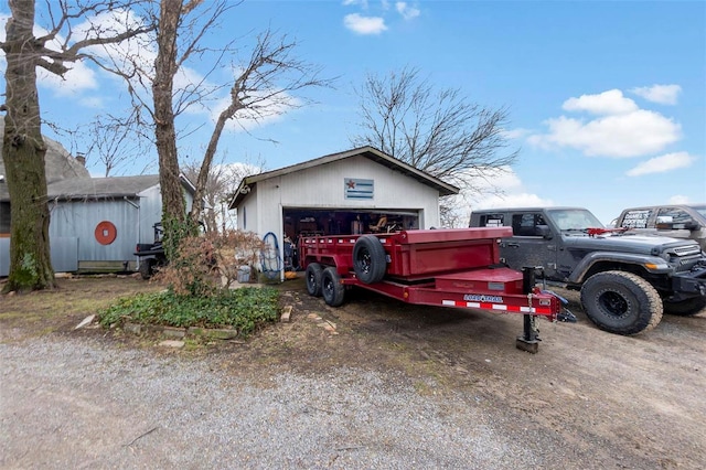 view of front of house with an outbuilding and a garage