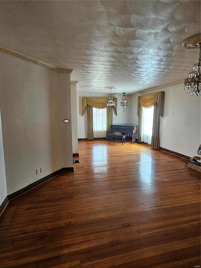 interior space with crown molding and dark hardwood / wood-style floors
