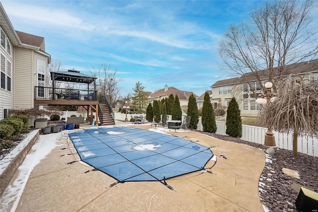 view of swimming pool with a fenced in pool, stairs, fence, a gazebo, and a patio area