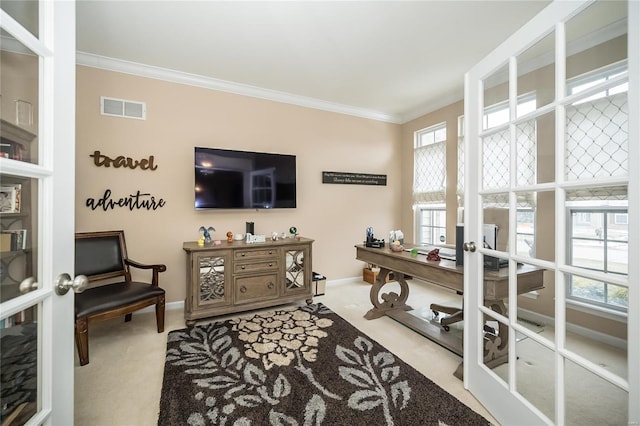 office area with visible vents, french doors, crown molding, and light colored carpet