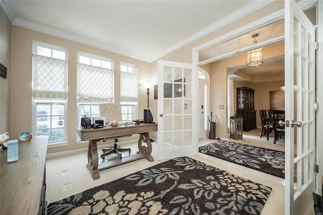 office space featuring baseboards, ornamental molding, light colored carpet, and french doors