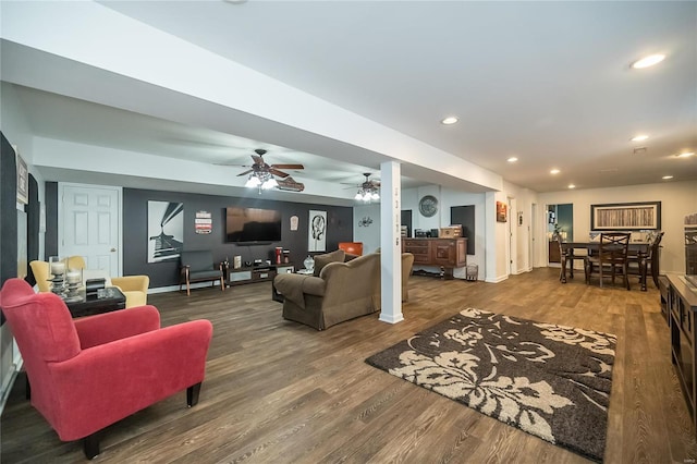 living area featuring recessed lighting, baseboards, and wood finished floors