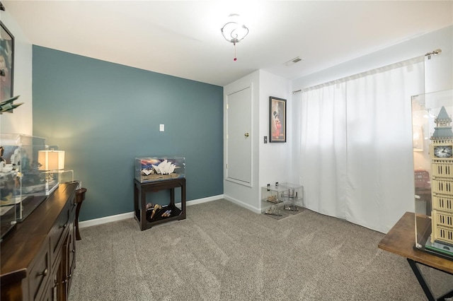 bedroom featuring carpet floors, visible vents, and baseboards