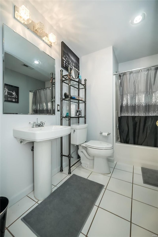 full bath with visible vents, tile patterned flooring, shower / bath combination with curtain, and toilet