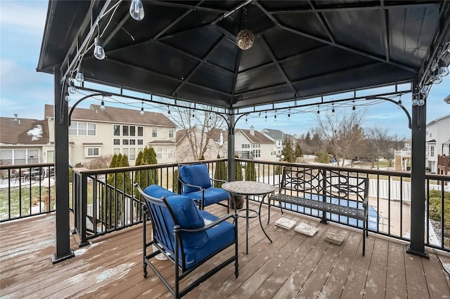 deck with a residential view and a gazebo