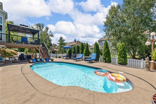 view of swimming pool with stairs, a patio, fence, and a fenced in pool