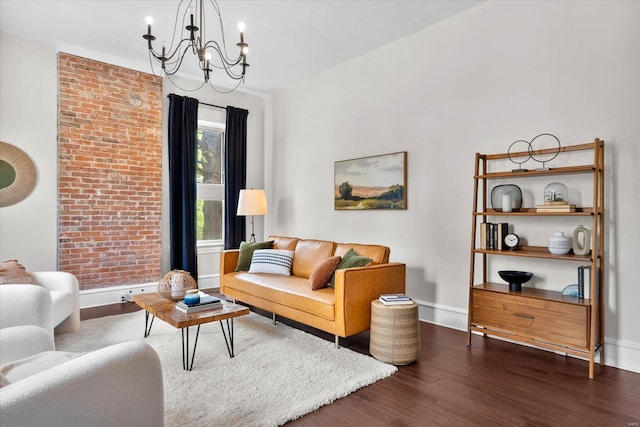 living area with dark wood-type flooring, baseboards, and a notable chandelier