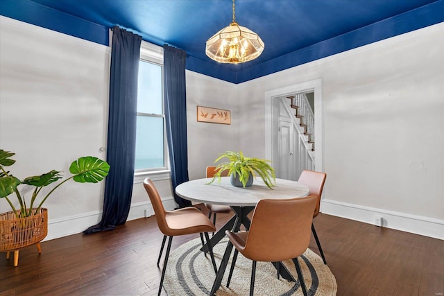dining room featuring stairs, dark wood-style flooring, baseboards, and a healthy amount of sunlight