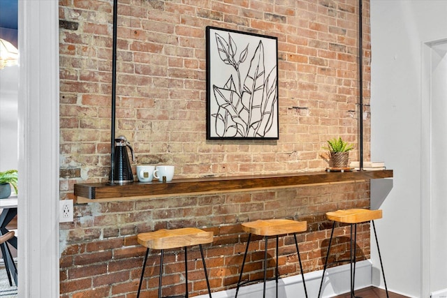 bar featuring brick wall
