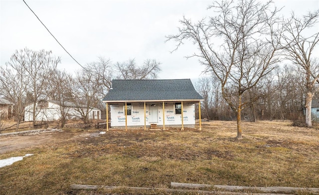 unfinished property with covered porch