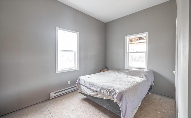 bedroom featuring a baseboard heating unit