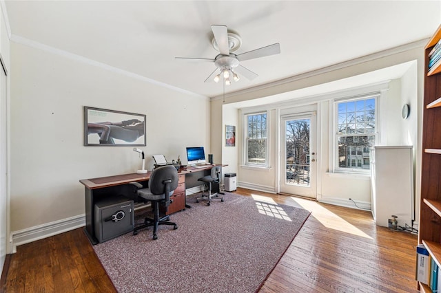 office area featuring baseboards, ornamental molding, ceiling fan, and hardwood / wood-style floors