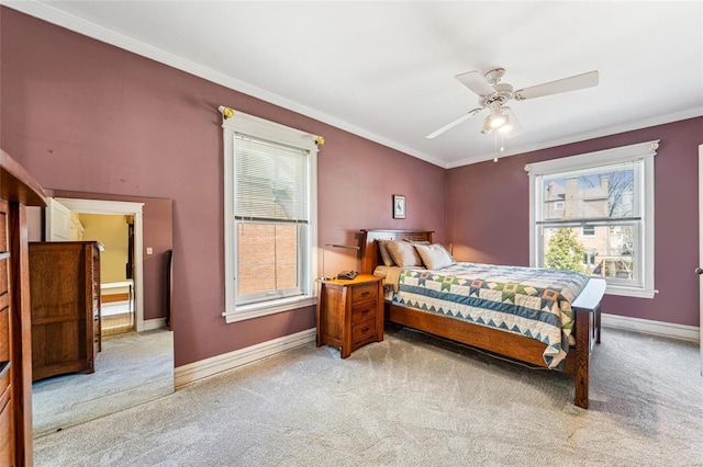 bedroom with light carpet, ornamental molding, a ceiling fan, and baseboards