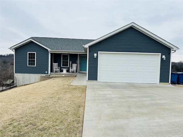 ranch-style house featuring a garage, covered porch, and a front lawn