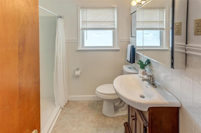 full bathroom featuring toilet, a wainscoted wall, tile walls, vanity, and a shower with curtain