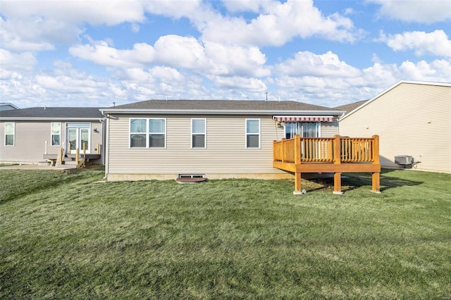 back of property featuring cooling unit, a lawn, and a wooden deck