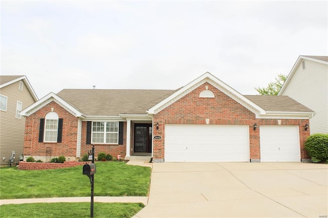 ranch-style house featuring a garage and a front lawn