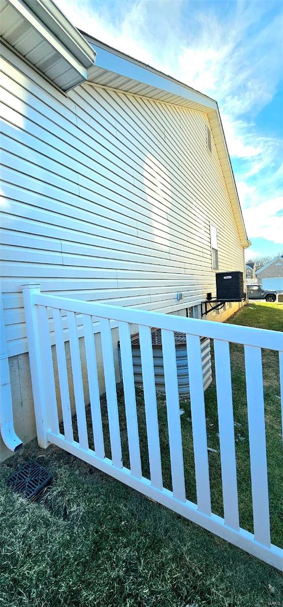 view of side of home featuring a lawn