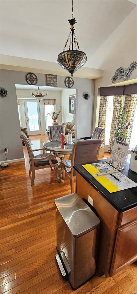 dining area with hardwood / wood-style flooring and plenty of natural light