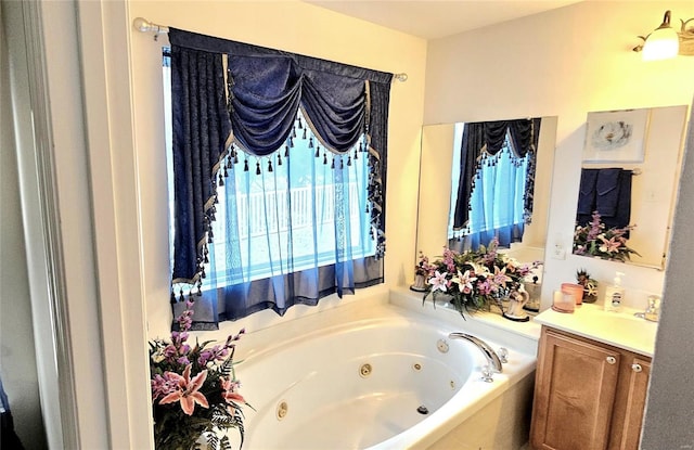 bathroom featuring vanity and a tub to relax in