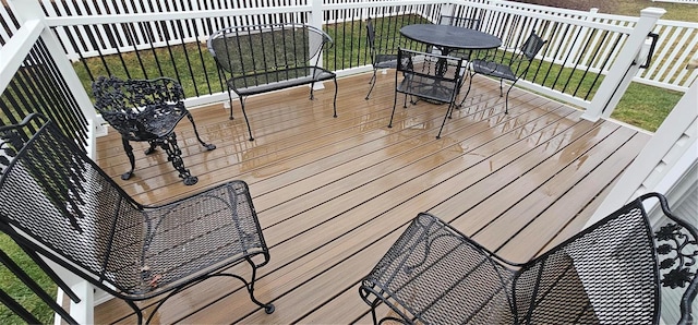 wooden terrace with a yard