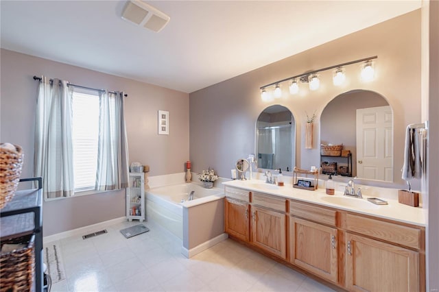 full bathroom featuring visible vents, a sink, and a bath