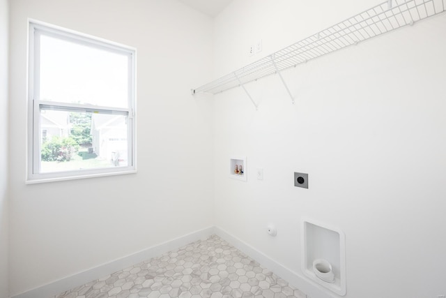 washroom featuring gas dryer hookup, hookup for an electric dryer, laundry area, washer hookup, and baseboards