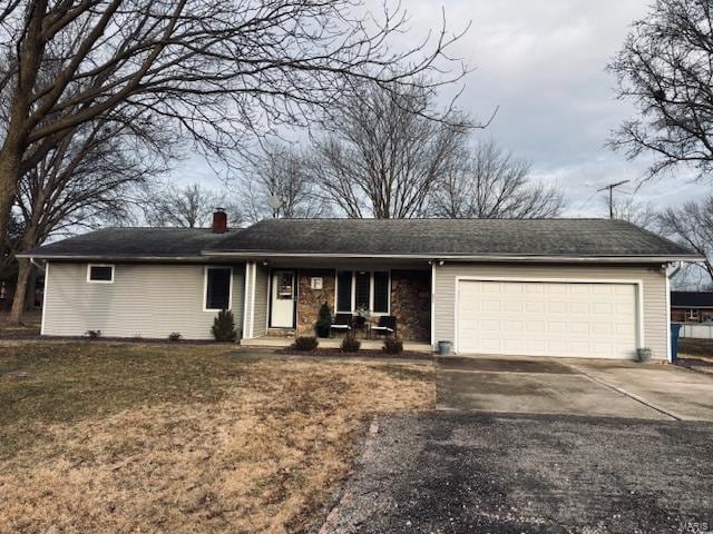 single story home featuring a garage