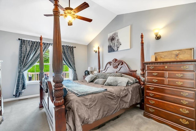 carpeted bedroom with ceiling fan and vaulted ceiling