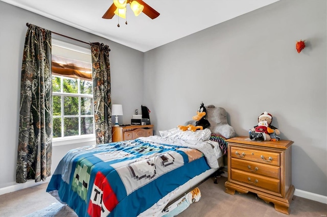 carpeted bedroom featuring ceiling fan