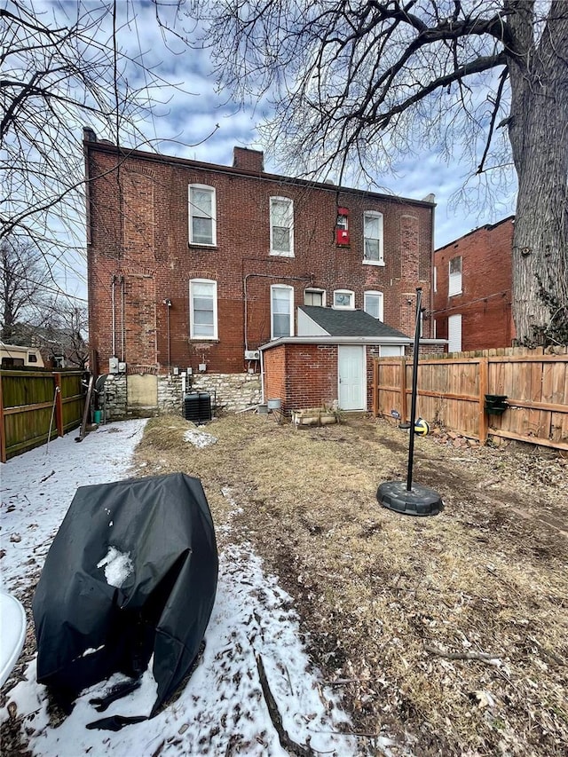 snow covered property featuring cooling unit