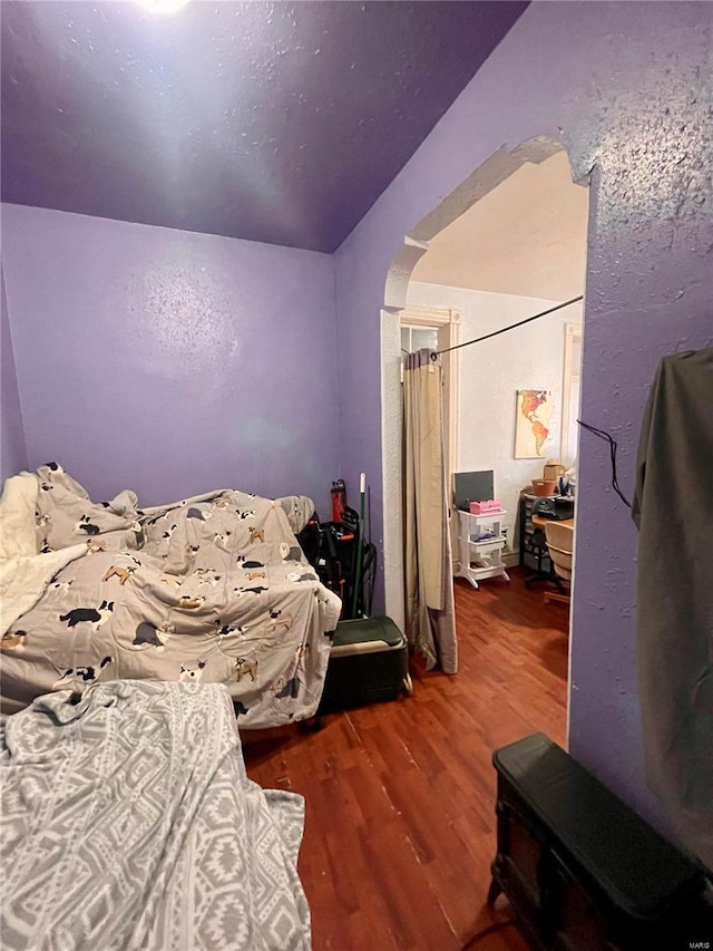 bedroom featuring dark hardwood / wood-style flooring