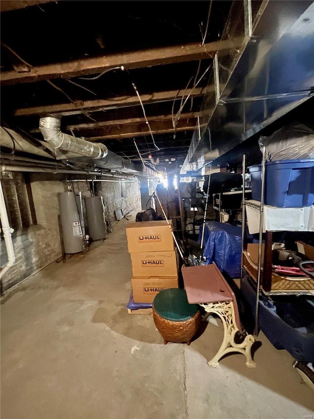 basement featuring water heater and gas water heater