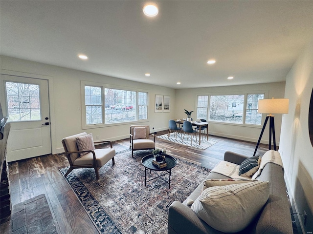 living room with baseboards, dark wood-style flooring, and recessed lighting