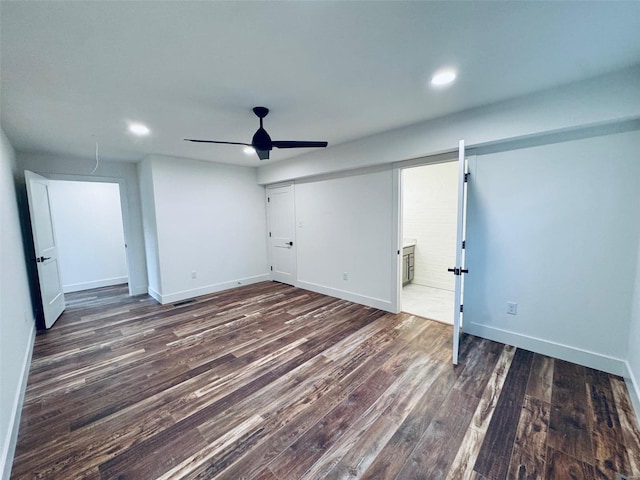 interior space with a ceiling fan, recessed lighting, dark wood finished floors, and baseboards