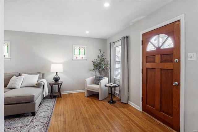 entryway with recessed lighting, baseboards, and light wood-style floors