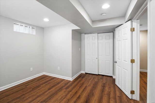 unfurnished bedroom with recessed lighting, baseboards, dark wood-style flooring, and a closet