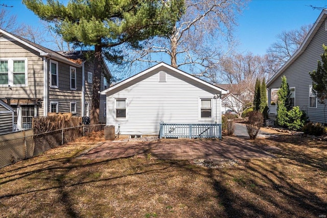 back of house with fence