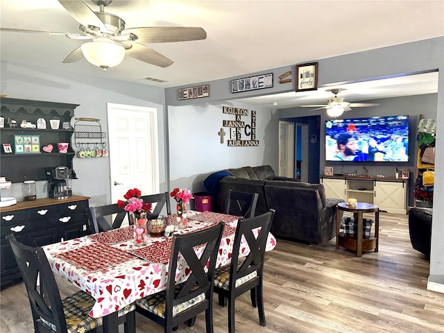 dining area featuring ceiling fan and hardwood / wood-style floors