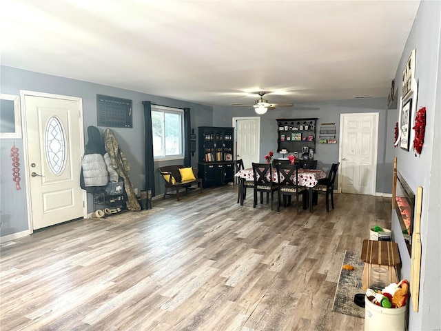 dining room featuring ceiling fan and light hardwood / wood-style flooring