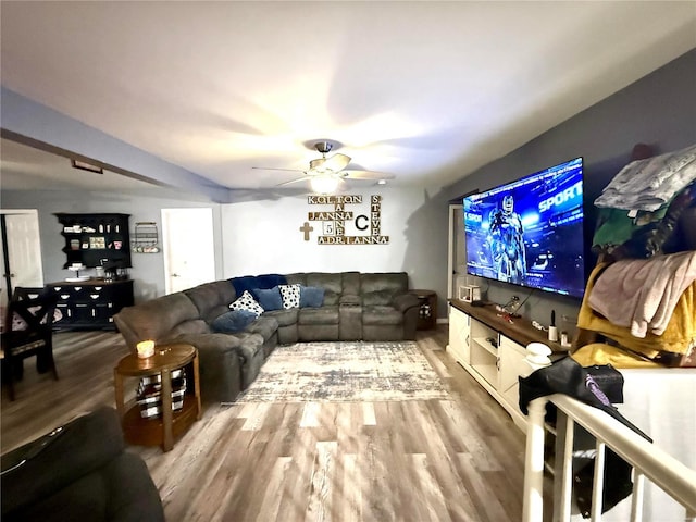 living room featuring hardwood / wood-style flooring and ceiling fan