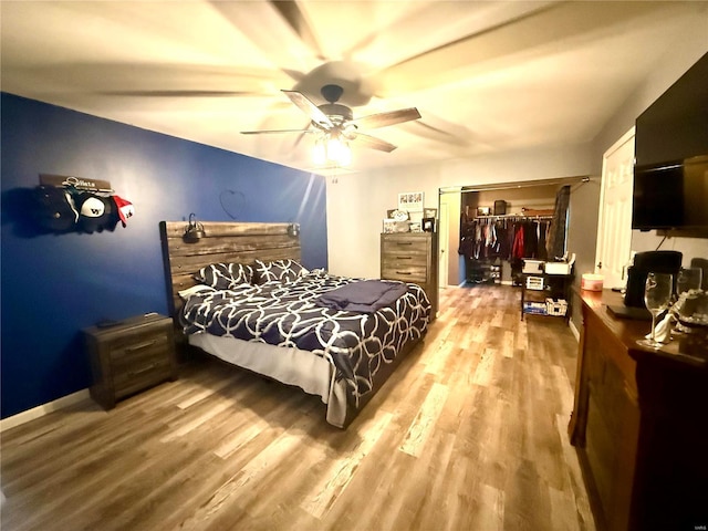 bedroom featuring ceiling fan and wood-type flooring