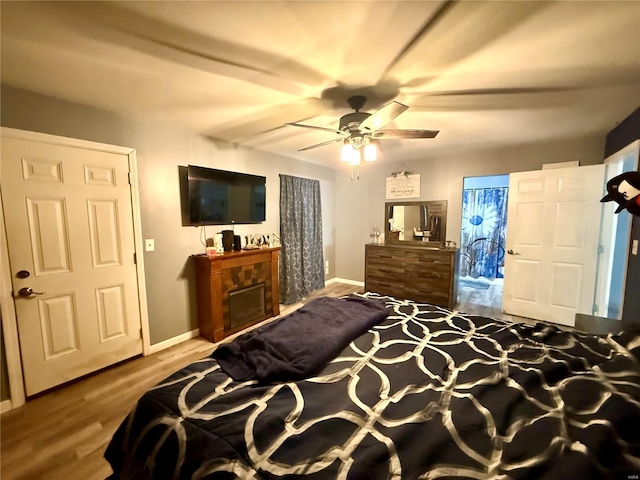 bedroom with hardwood / wood-style flooring and ceiling fan